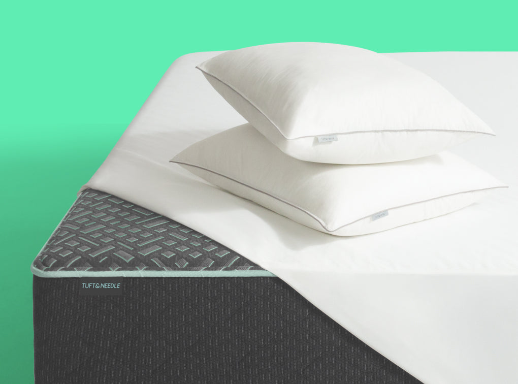 Tuft and Needle Mattress Bundle on a green background