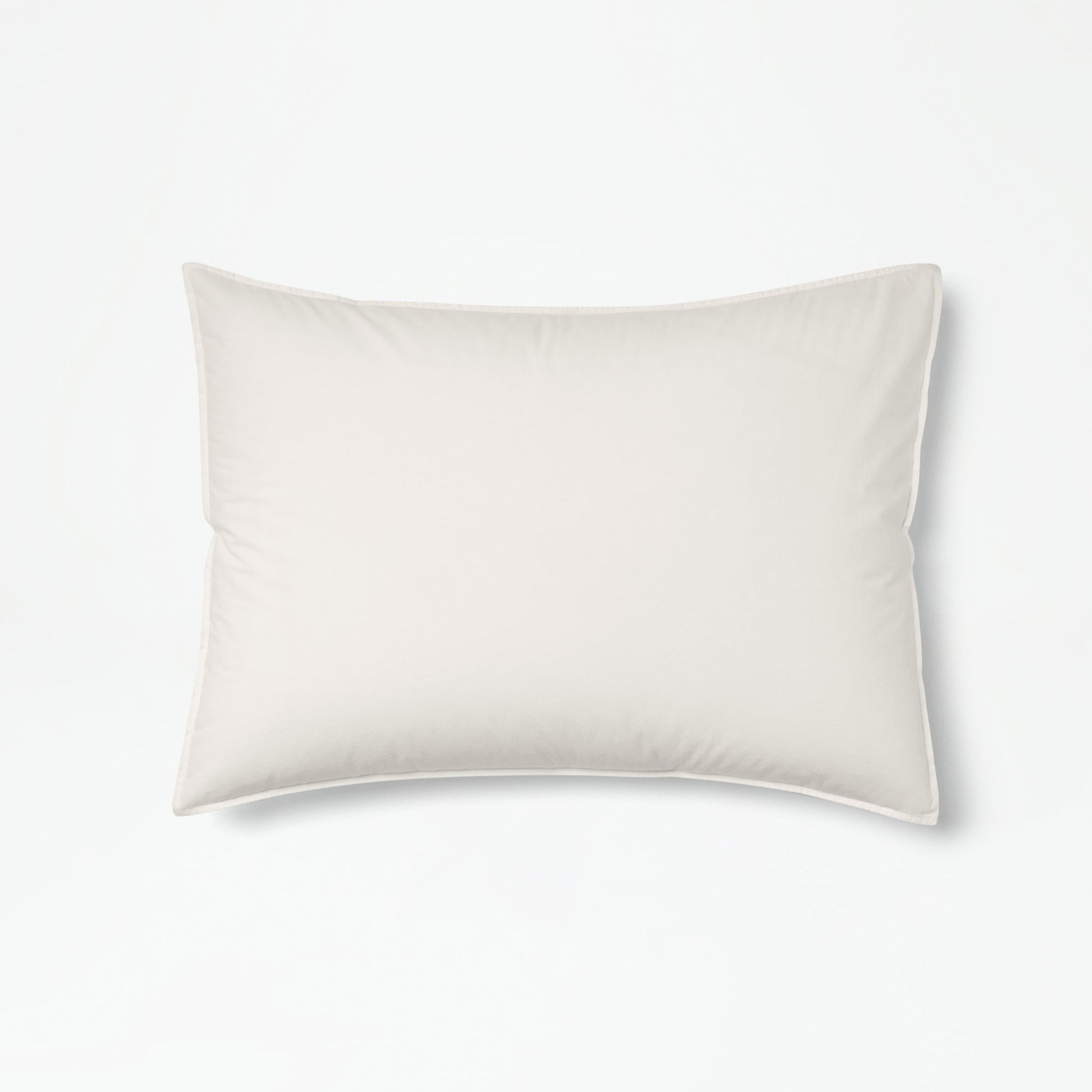 The Tuft and Needle Percale Duvet Cover Set on a mattress in a bedroom||color:sand