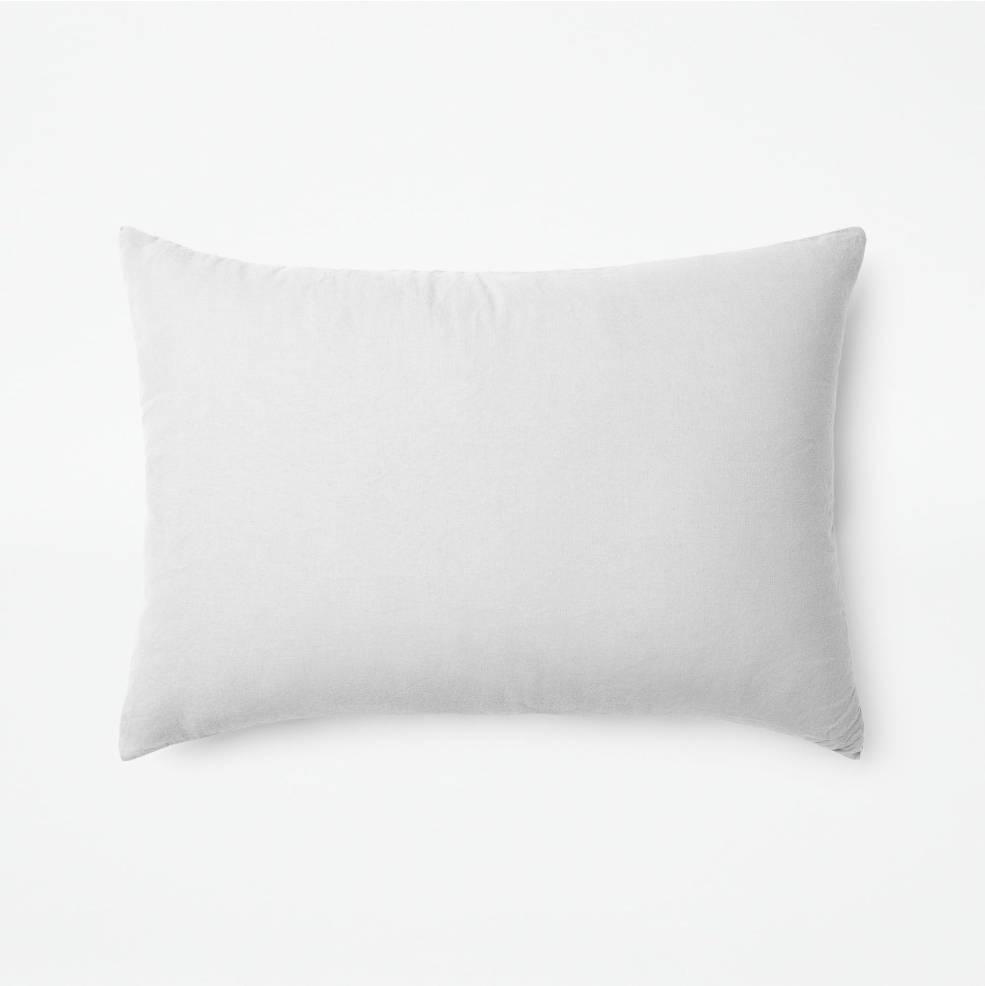The Tuft and Needle Linen-Cotton Blend Duvet Set, one pillow laying horizontally || color: Cloud
