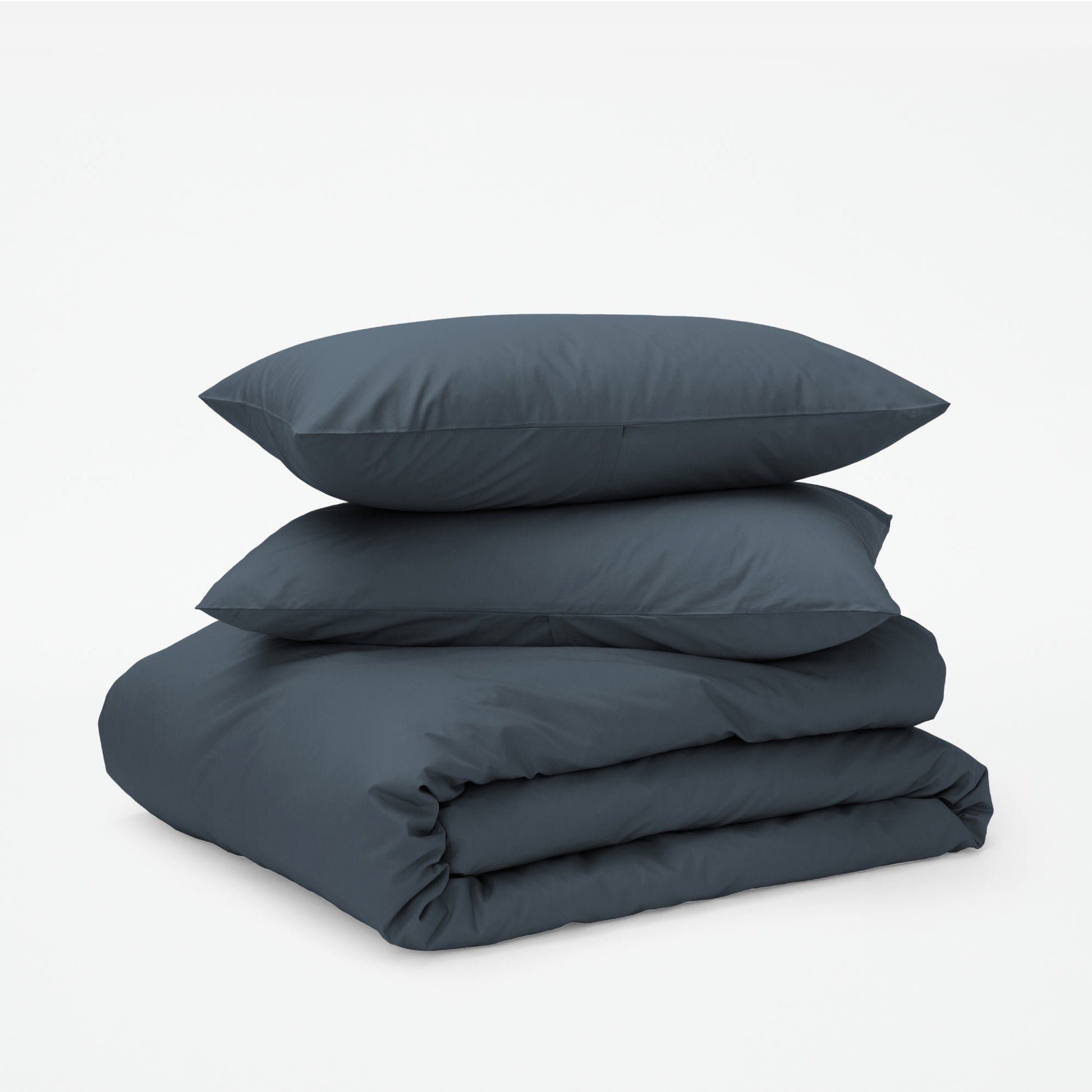The Tuft and Needle Classic Percale Duvet Set, two pillows stacked on top of a sheet set || color: Slate
