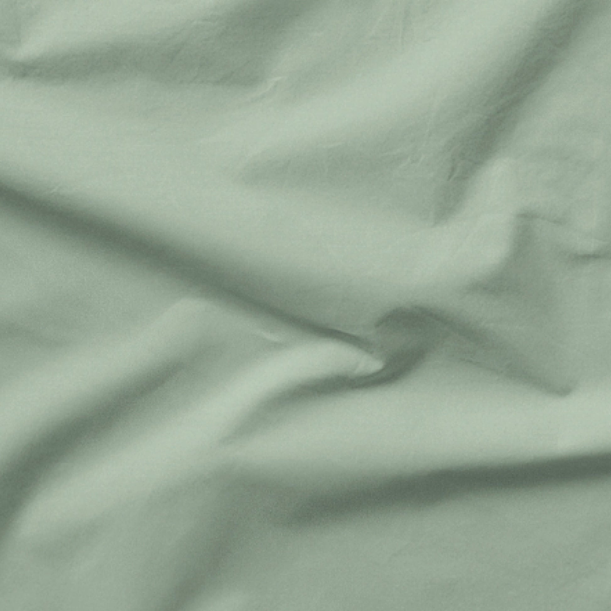 The Tuft and Needle Classic Percale Sheet Set, one sheet spread out || color: Sage