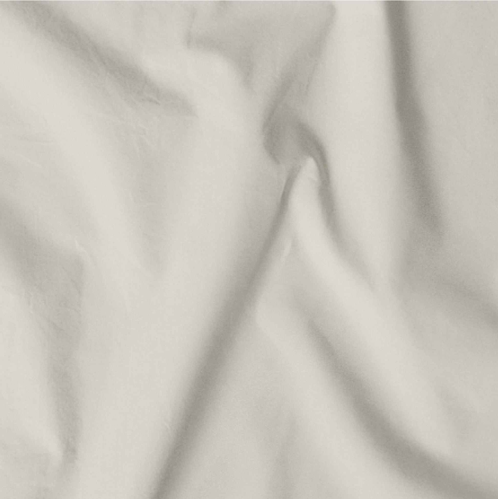 The Tuft and Needle Classic Percale Sheet Set, one sheet spread out || color: Sand
