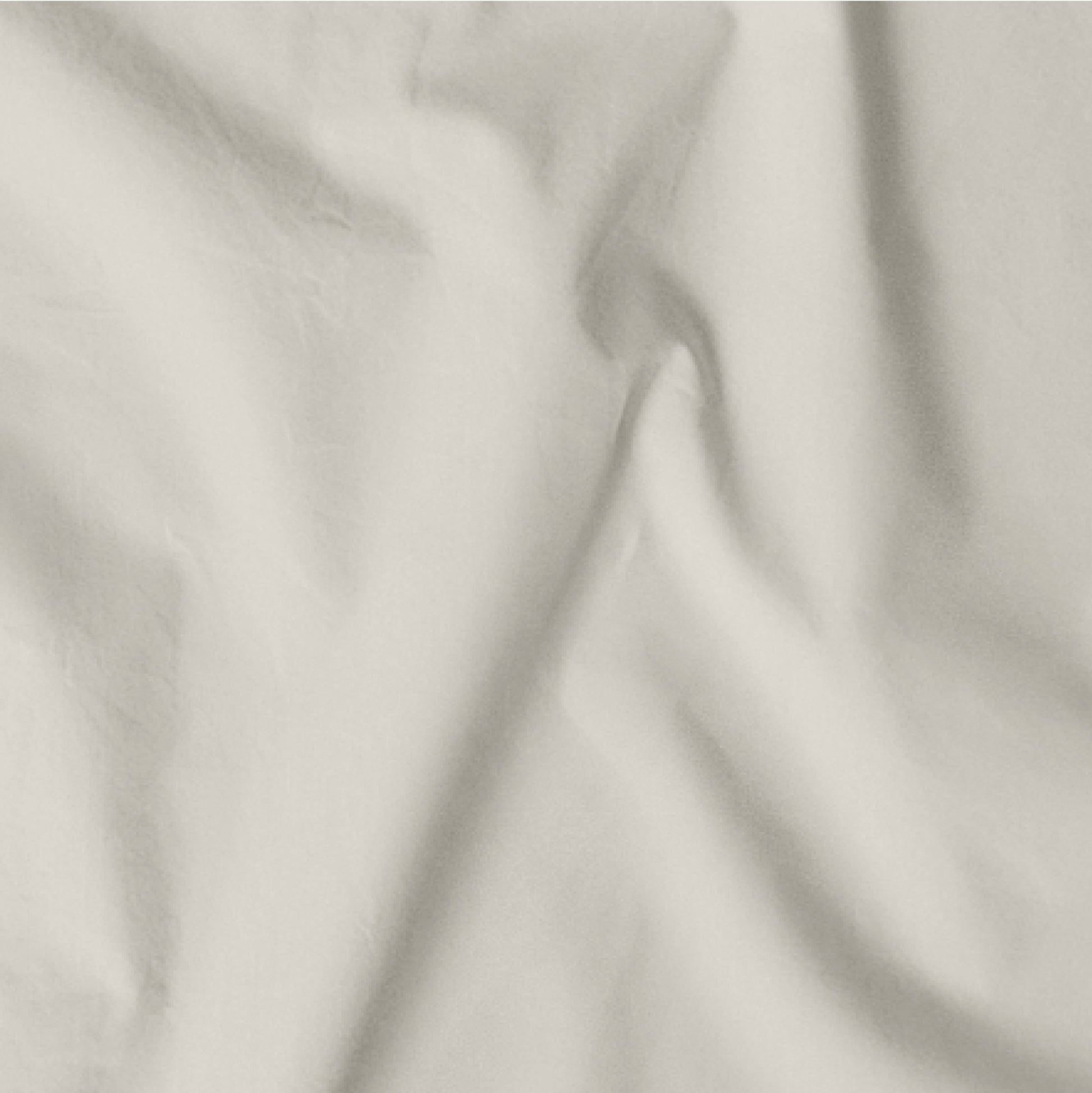The Tuft and Needle Classic Percale Sheet Set, one sheet spread out || color: Sand
