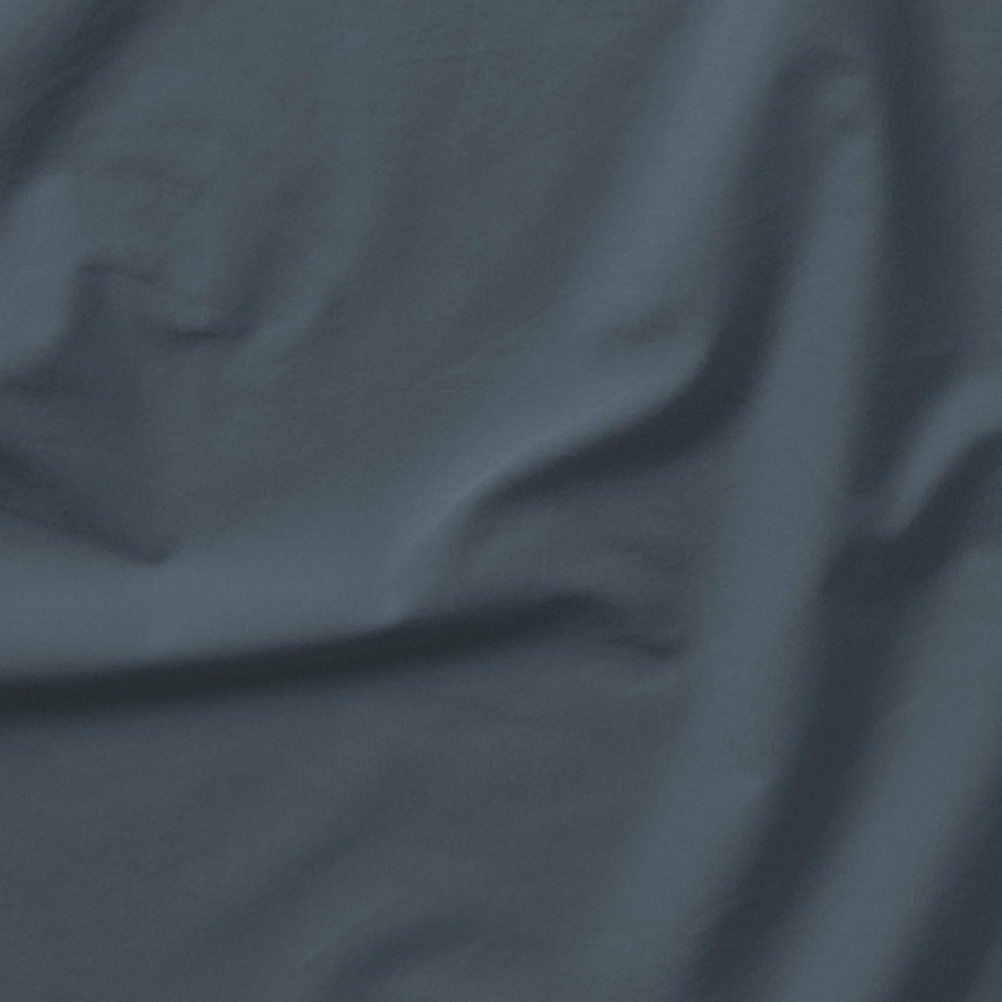 The Tuft and Needle Classic Percale Sheet Set, one sheet spread out || color: Slate
