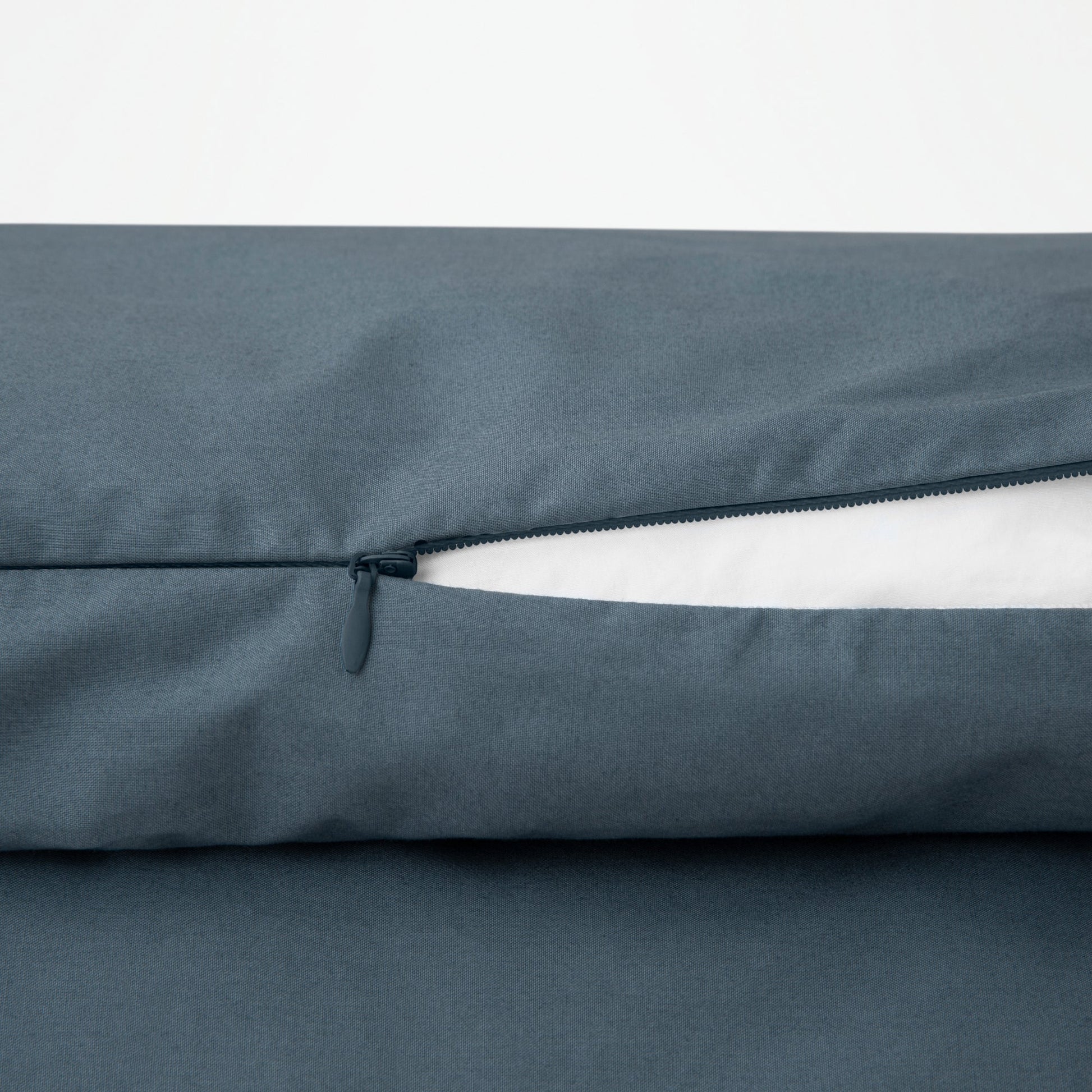 Close-up view of the zipper on the Tuft and Needle Percale Duvet Cover Set||color:sand
