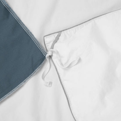 Close-up view of the corner ties on the Tuft and Needle Percale Duvet Cover Set||color:sand